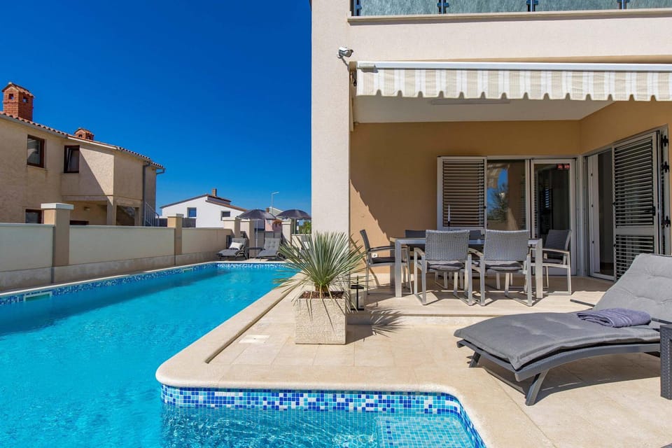 Property building, Patio, Day, View (from property/room), Balcony/Terrace, Living room, Seating area, Pool view, Swimming pool, sunbed