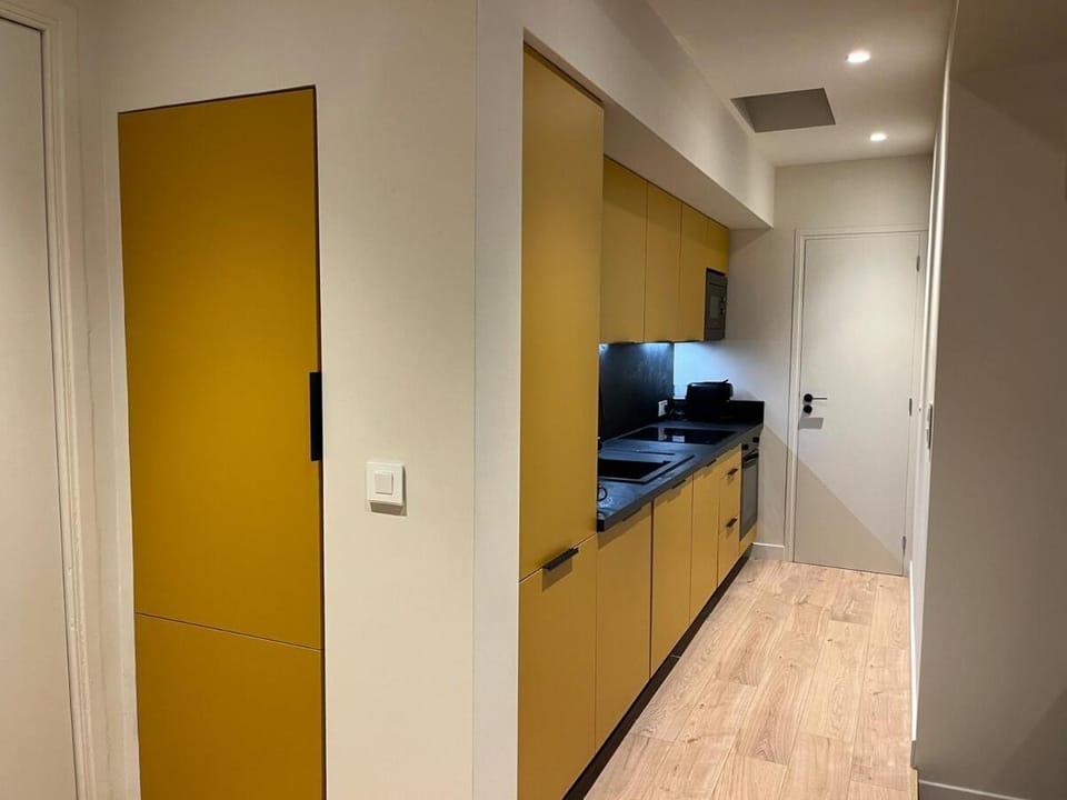 Kitchen or kitchenette, dishwasher, microwave, oven, stove, washing machine, dryer