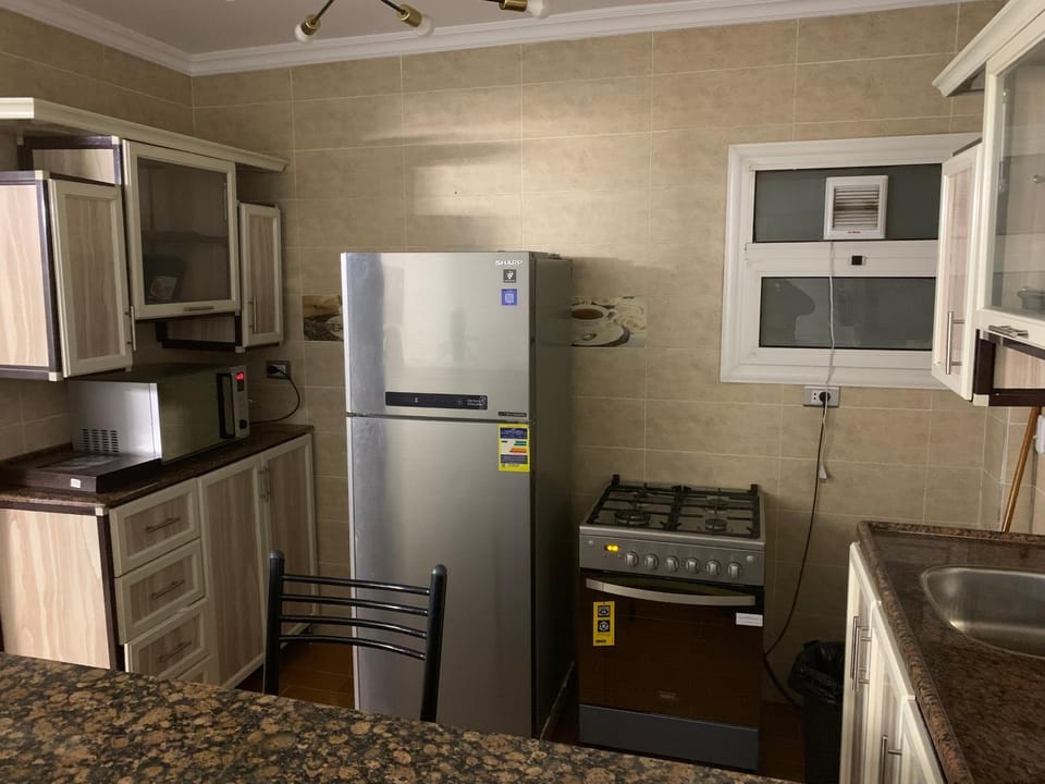 Kitchen or kitchenette, microwave, oven, stove, kitchen