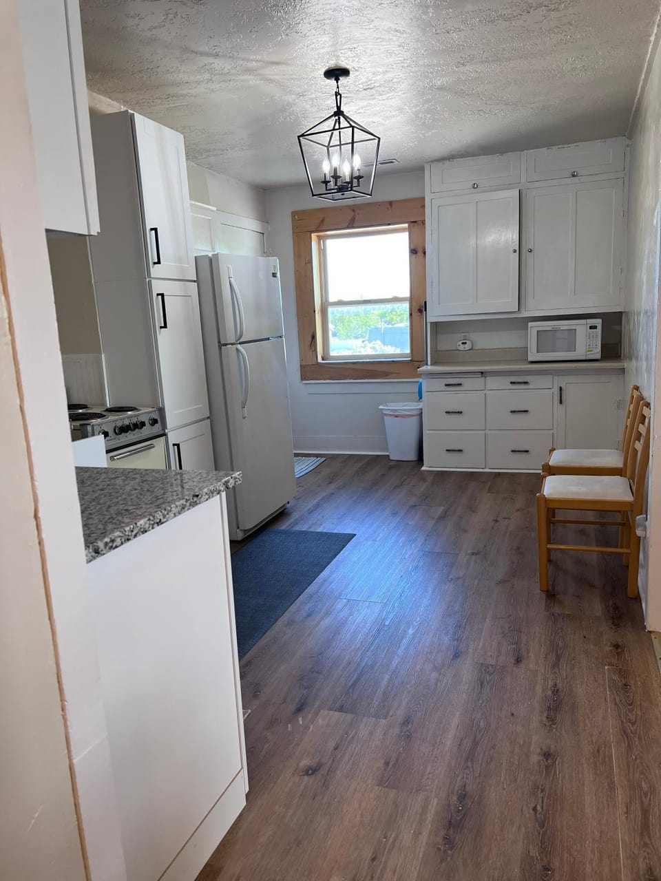 Kitchen or kitchenette, microwave, storage, stove, kitchen