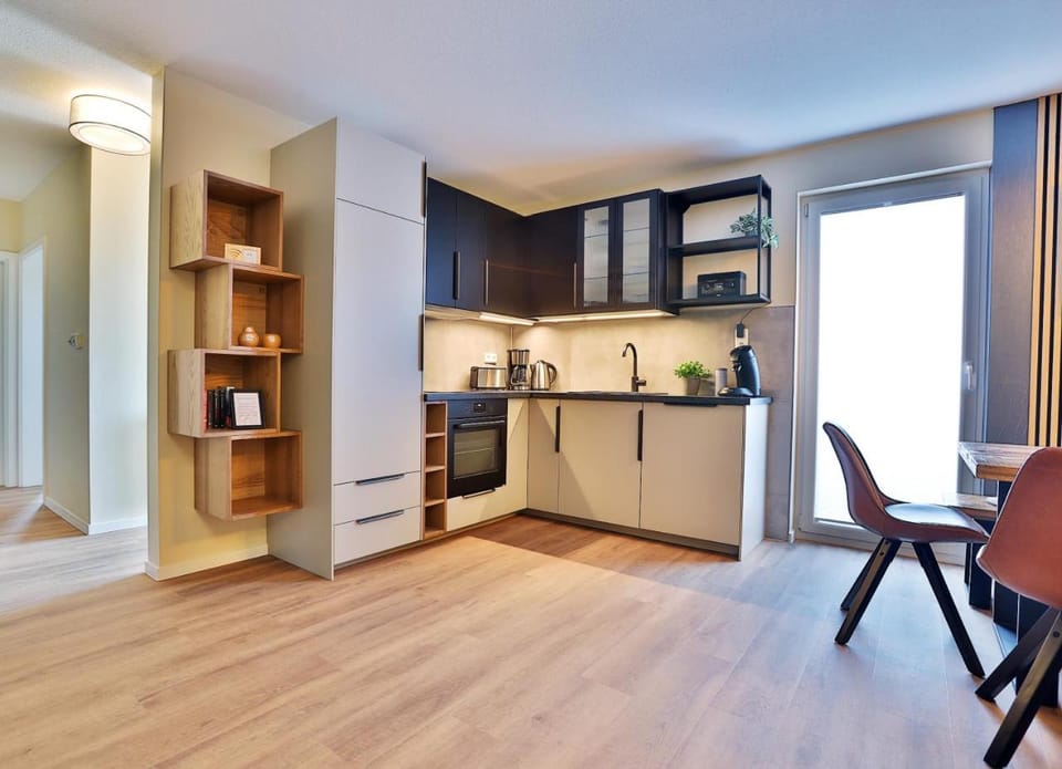 Kitchen or kitchenette, dishwasher, oven, stove