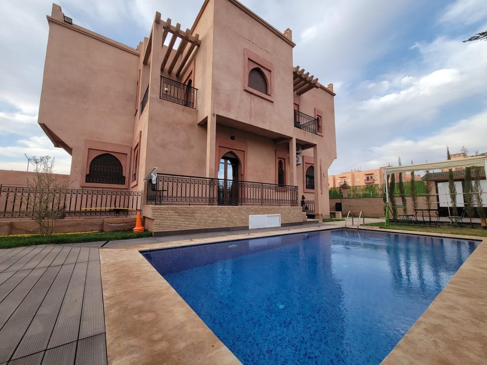 Property building, Patio, Pool view, Swimming pool, sunbed