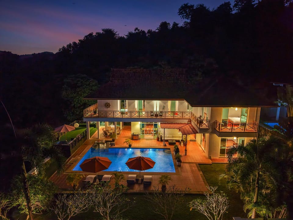 Property building, Patio, Night, Natural landscape, Garden, Garden view, Pool view, Swimming pool