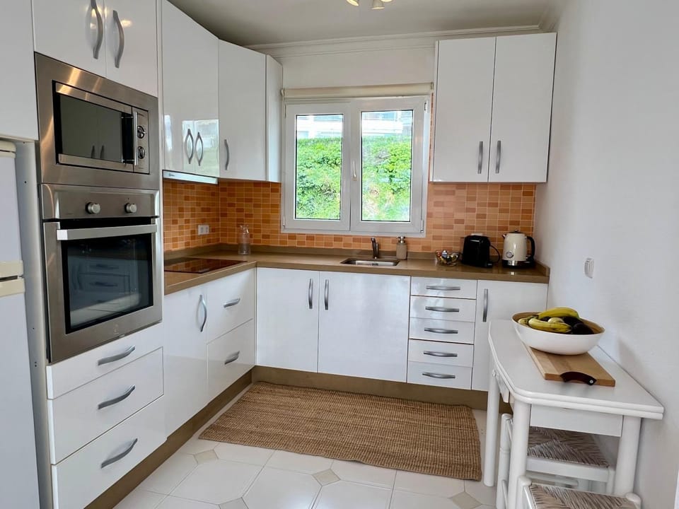Kitchen or kitchenette, oven, stove, toaster