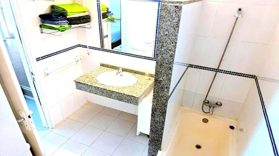 Bathroom, hair dryier, towels, washing machine