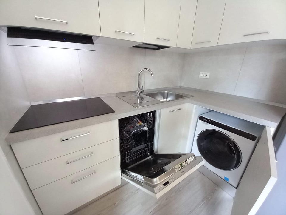 Kitchen or kitchenette, dishwasher, stove, washing machine