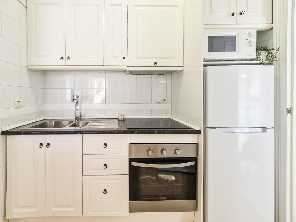 Kitchen or kitchenette, oven, stove