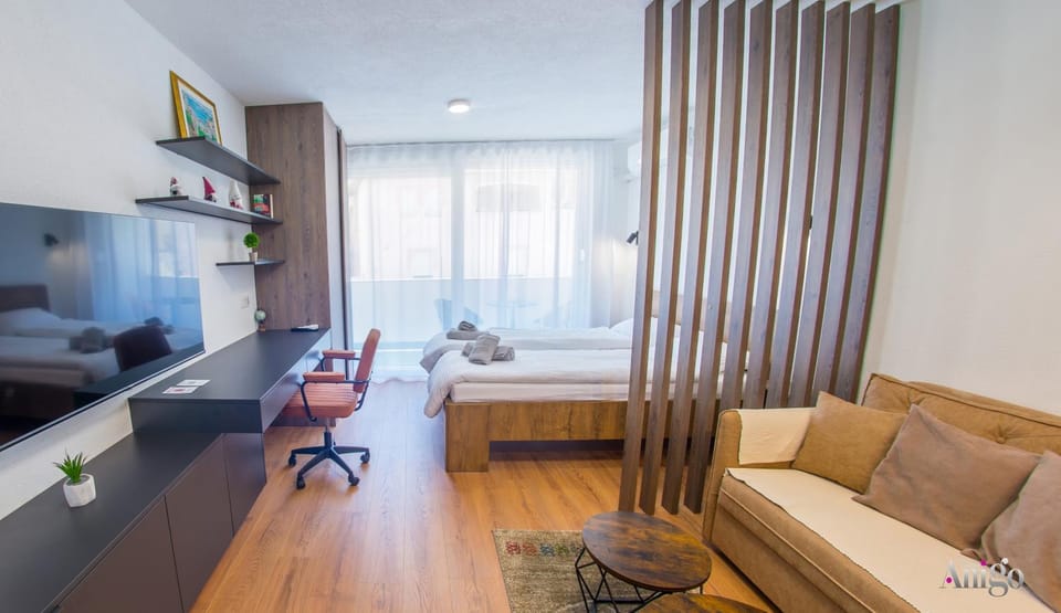 Bed, TV and multimedia, Living room, Seating area, Bedroom