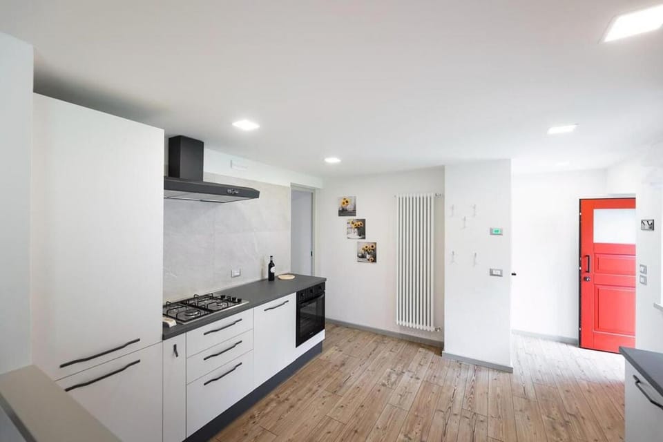 Kitchen or kitchenette, dishwasher, oven, stove