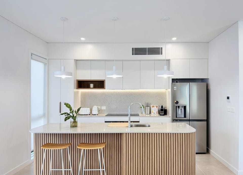 Kitchen or kitchenette, dishwasher, heating, microwave, oven, stove, toaster, air conditioner