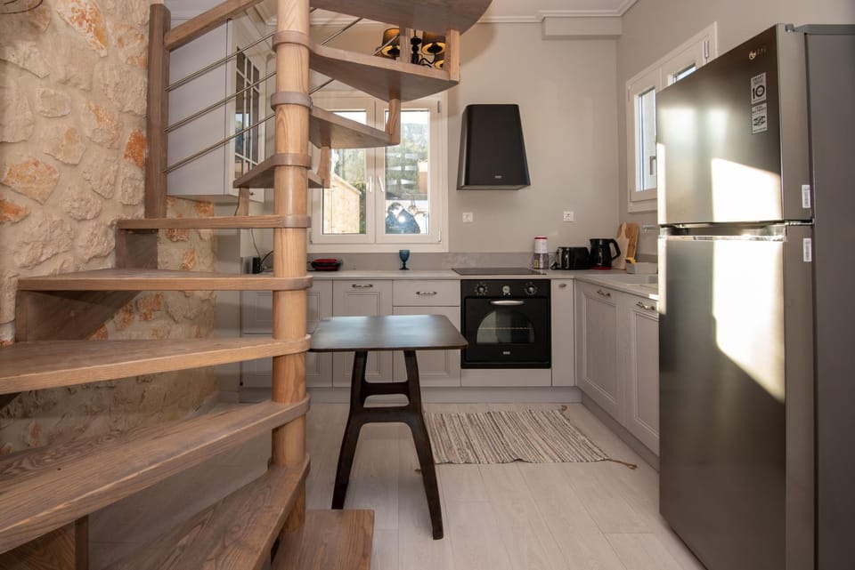 Kitchen or kitchenette, dishwasher, oven, stove