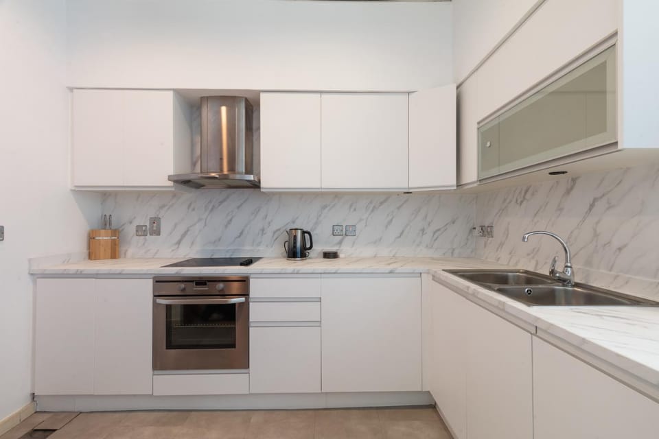 Kitchen or kitchenette, dishwasher, microwave, oven, stove, toaster