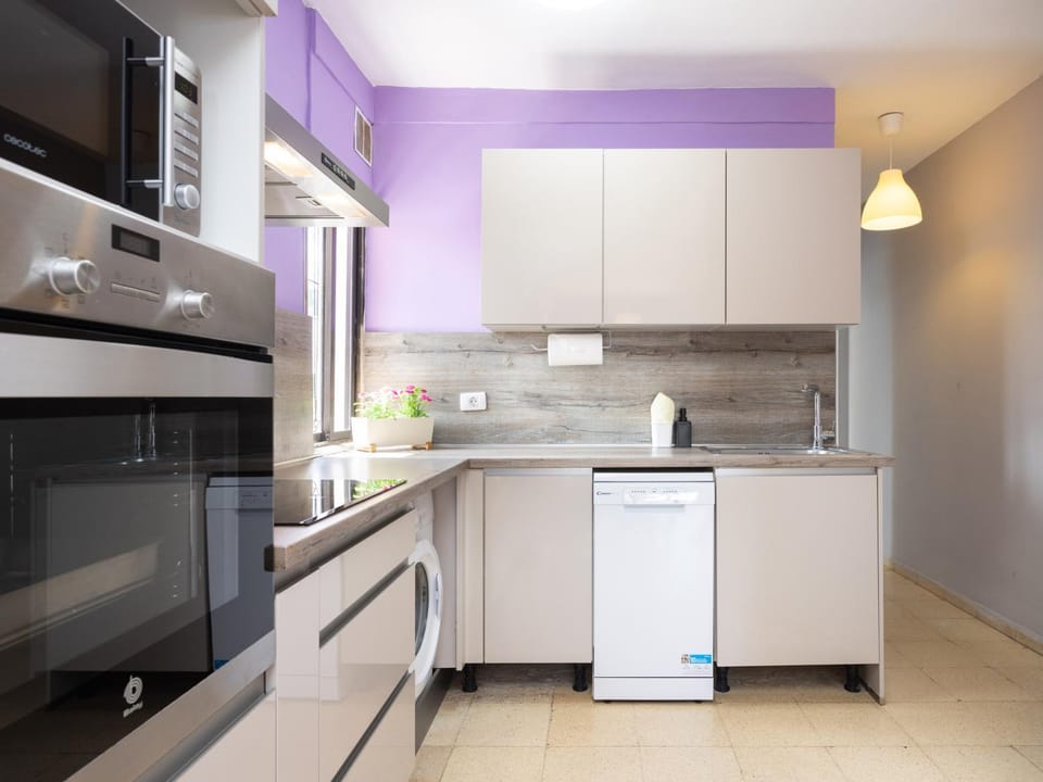 Kitchen or kitchenette, dishwasher, microwave, oven, stove, washing machine