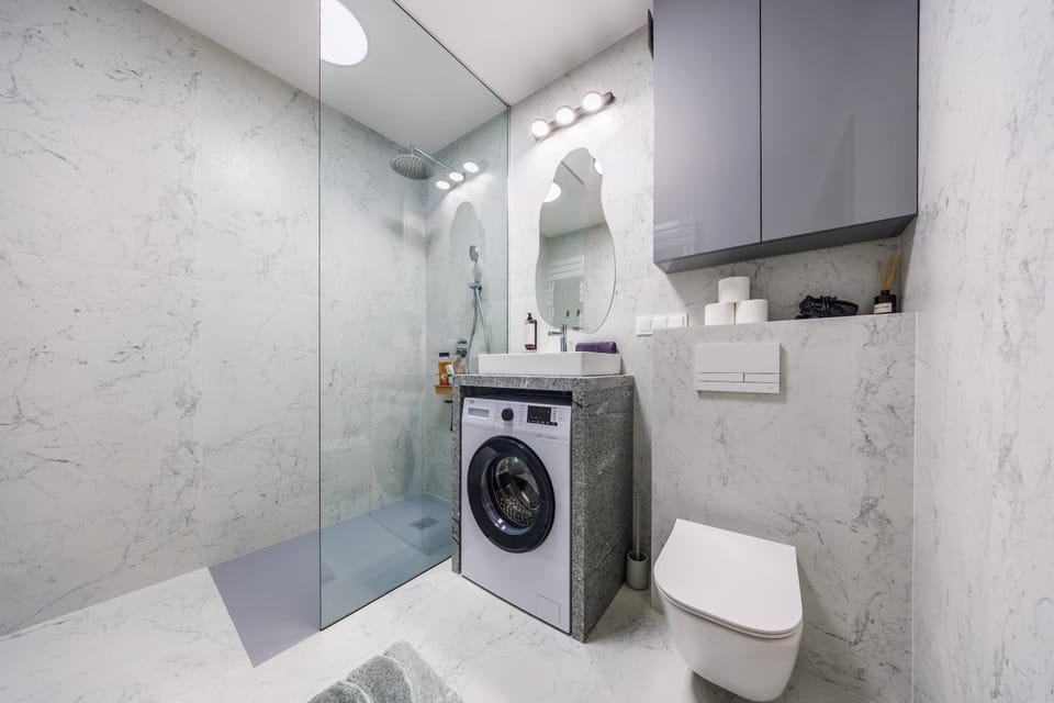 Shower, Toilet, Bathroom, towels, washing machine, dryer