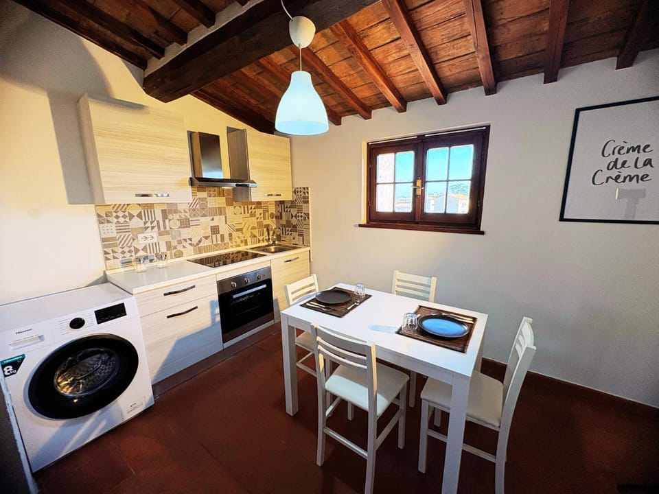 Kitchen or kitchenette, Dining area, stove, washing machine