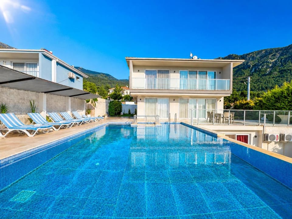 Property building, Seating area, Swimming pool, sunbed
