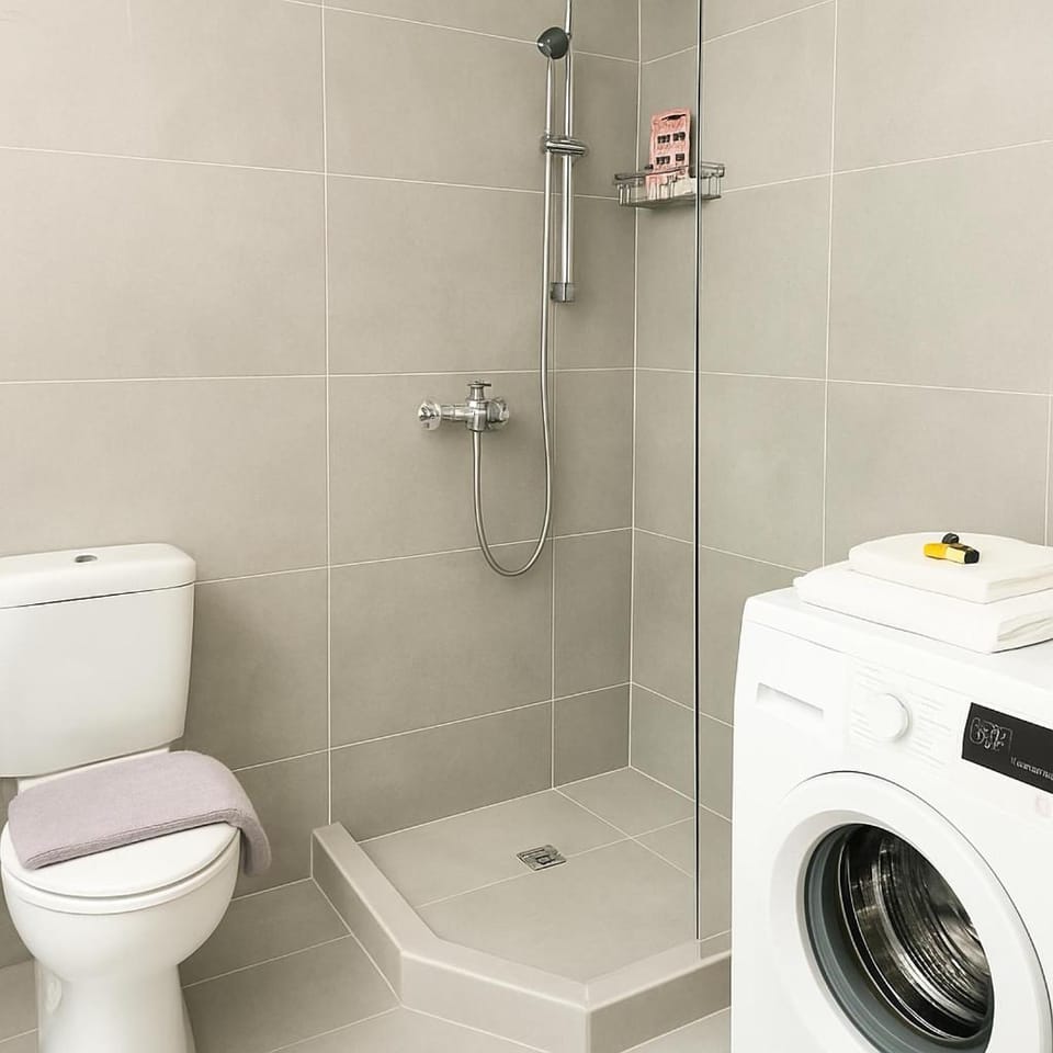 Shower, Toilet, Bathroom, bidet, towels, washing machine