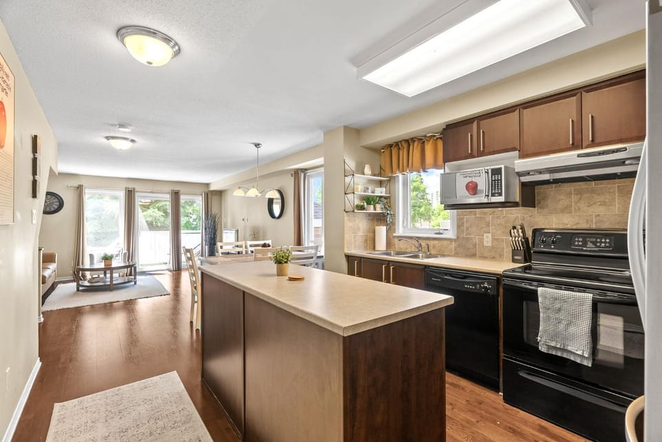 Kitchen or kitchenette, dishwasher, microwave, oven, stove, toaster