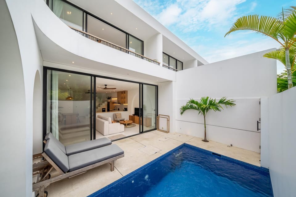 Property building, Patio, Natural landscape, Living room, Seating area, Pool view, Swimming pool, sunbed