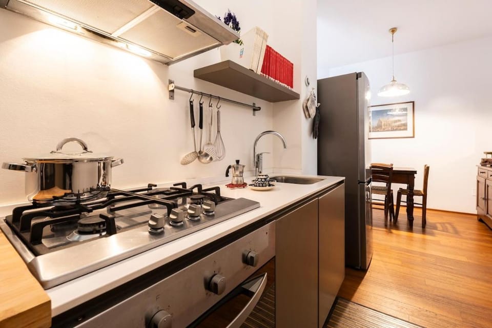 Kitchen or kitchenette, dishwasher, oven, stove