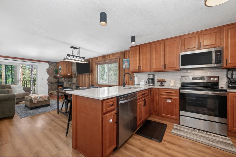 Kitchen or kitchenette, Living room, fireplace, furniture, microwave, oven