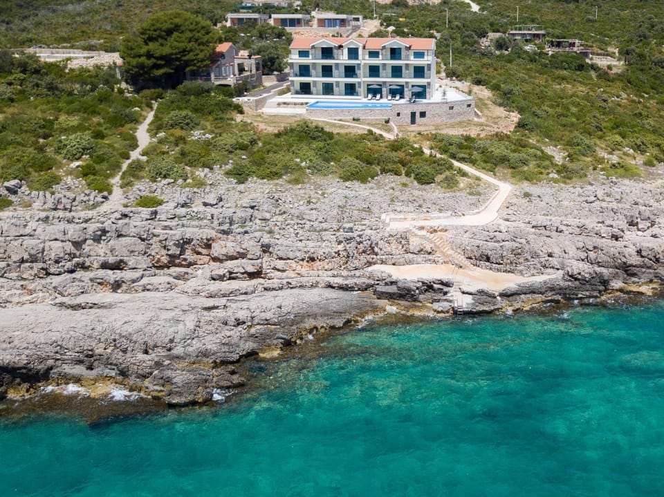 Property building, Day, Natural landscape, Beach, Sea view