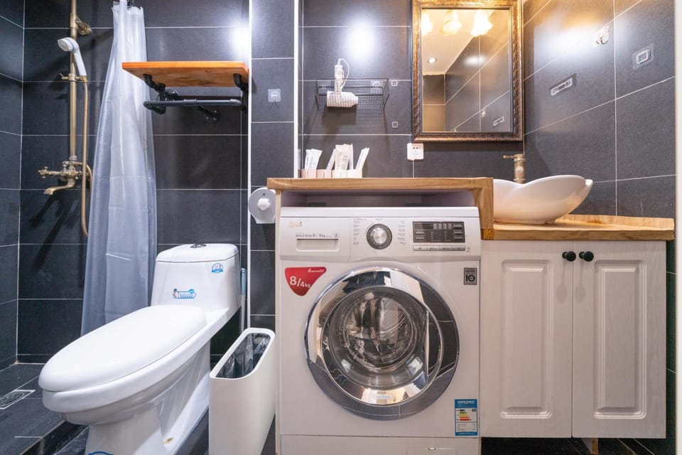 Toilet, Bathroom, towels, washing machine, dryer
