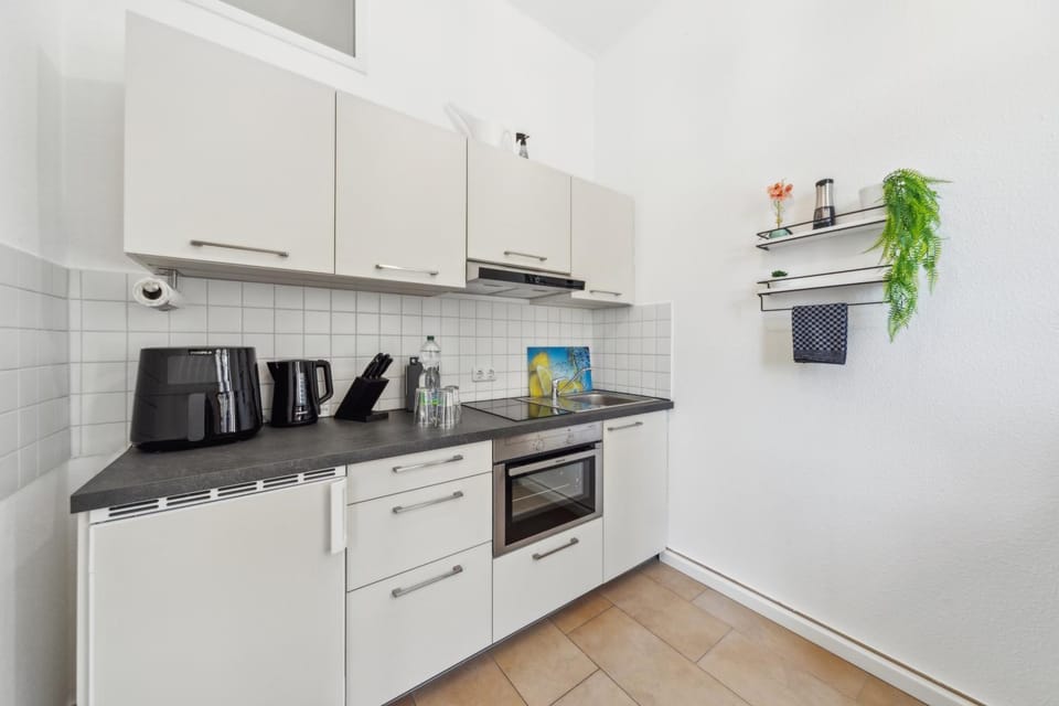 Kitchen or kitchenette, dishwasher, stove, toaster