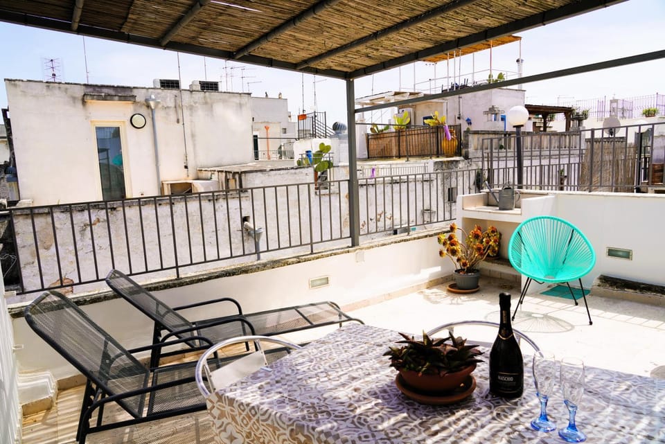 Property building, Patio, Day, View (from property/room), Balcony/Terrace, Living room, Seating area, Dining area, sunbed