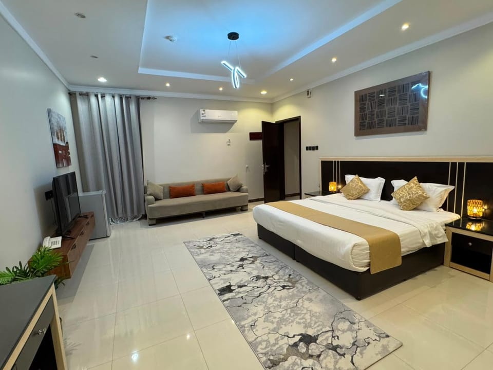 Bed, Living room, Seating area, Bedroom