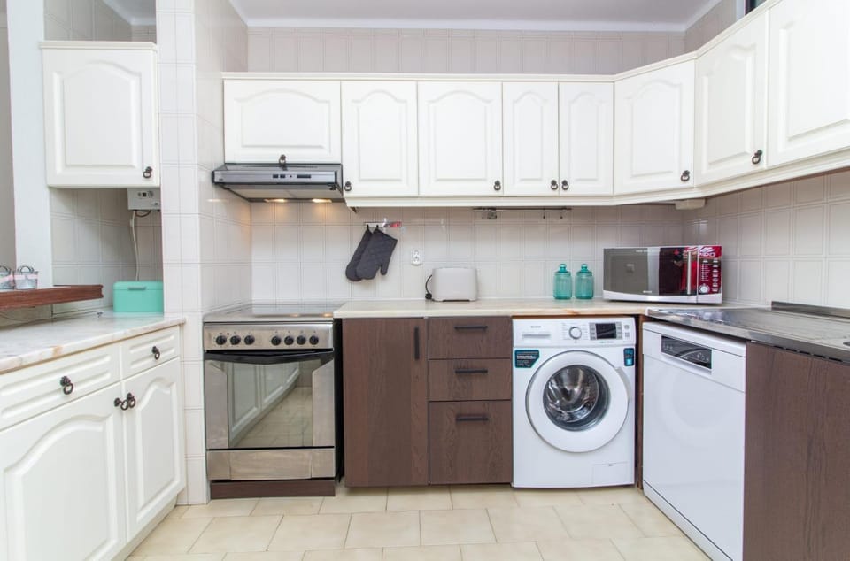 Kitchen or kitchenette, dishwasher, microwave, oven, stove, toaster, kitchen