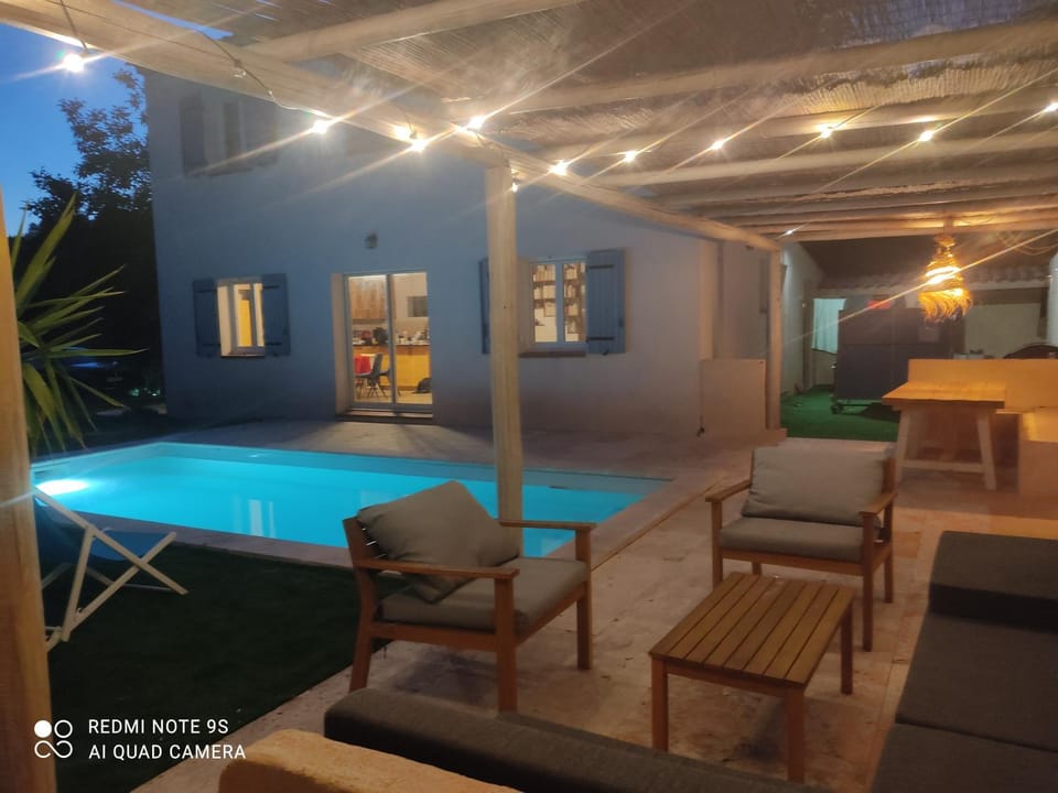 Patio, Night, Pool view, Swimming pool, sunbed