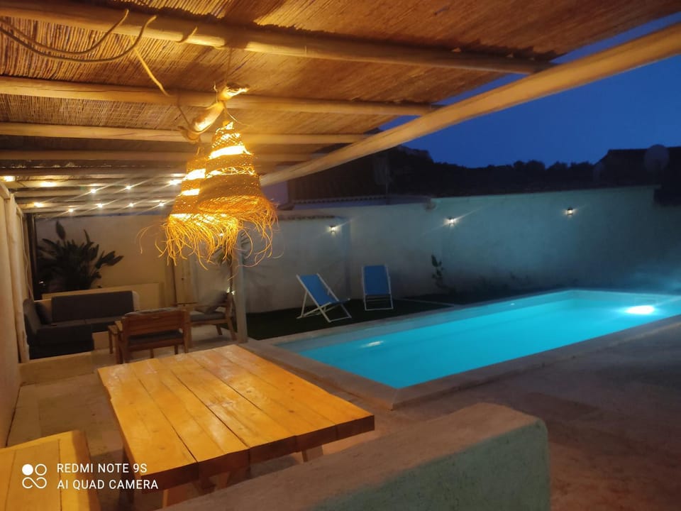 Patio, Night, Pool view, Swimming pool, sunbed