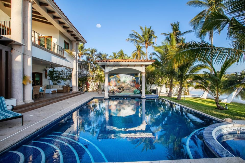 Magnificent Canal House with Dock and Adjacent Golf Villa in Nuevo Vallarta