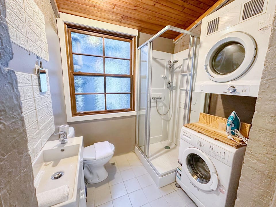 Shower, Toilet, Bathroom, towels, washing machine, dryer