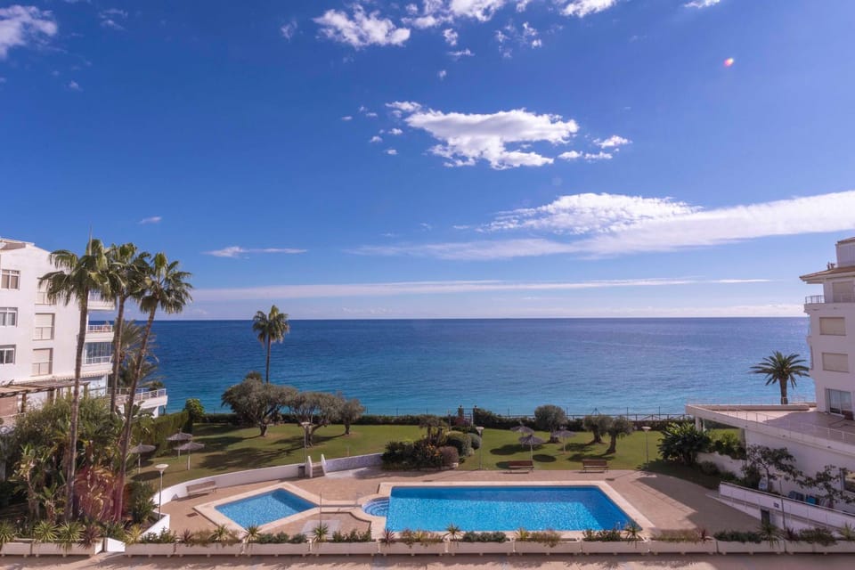 Property building, Nearby landmark, Day, Natural landscape, Beach, Pool view, Sea view, Swimming pool, sunbed