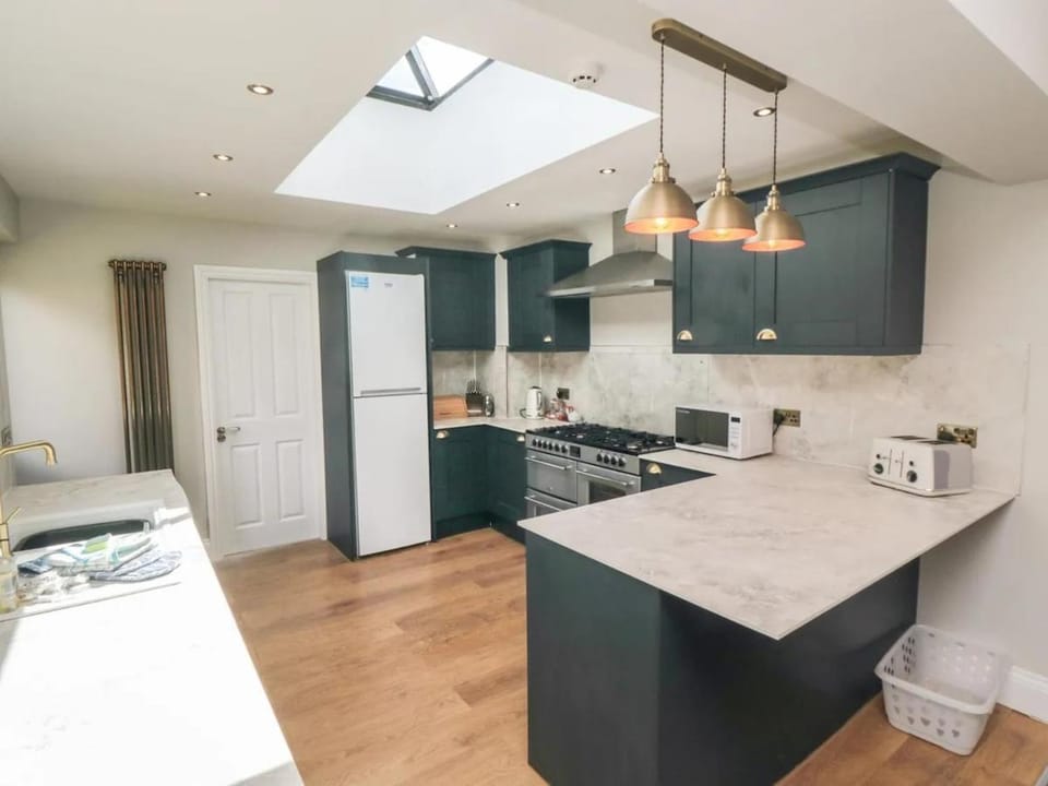 Kitchen or kitchenette, dishwasher, oven, stove