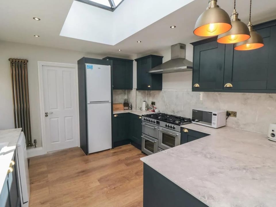 Kitchen or kitchenette, dishwasher, oven, stove, toaster