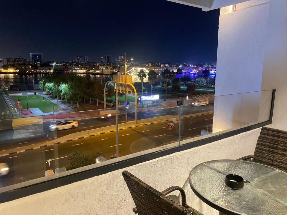 Patio, Night, View (from property/room), Balcony/Terrace, Living room, Seating area, Dining area, City view, Location