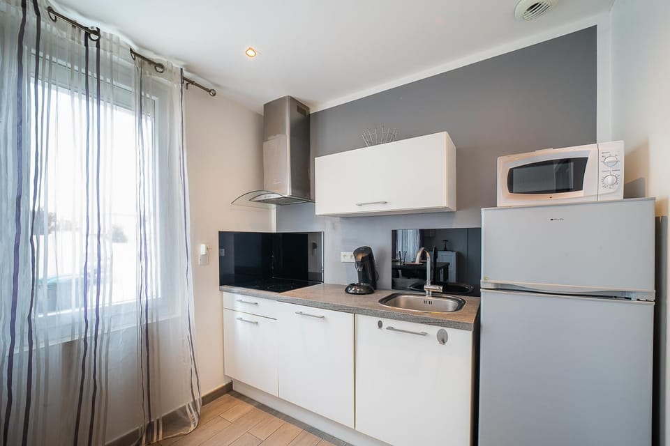 Kitchen or kitchenette, stove