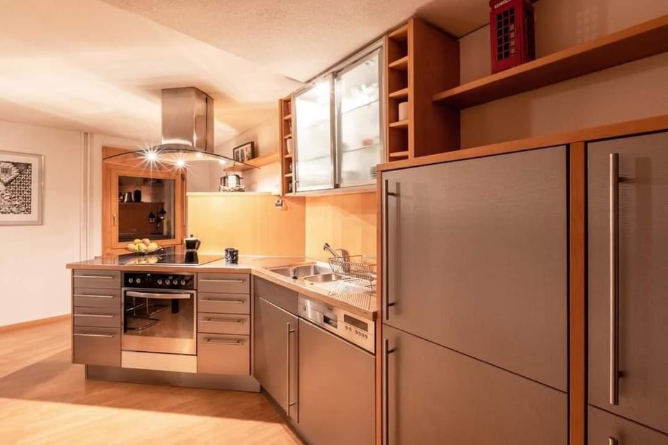 Kitchen or kitchenette, dishwasher, oven, stove