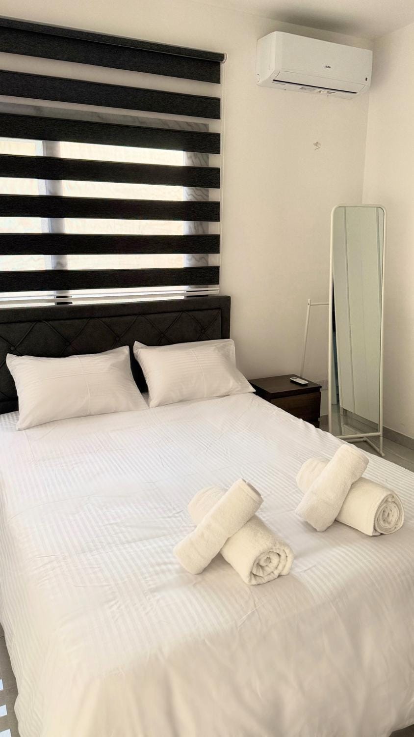 Bedroom, towels, wardrobe, air conditioner