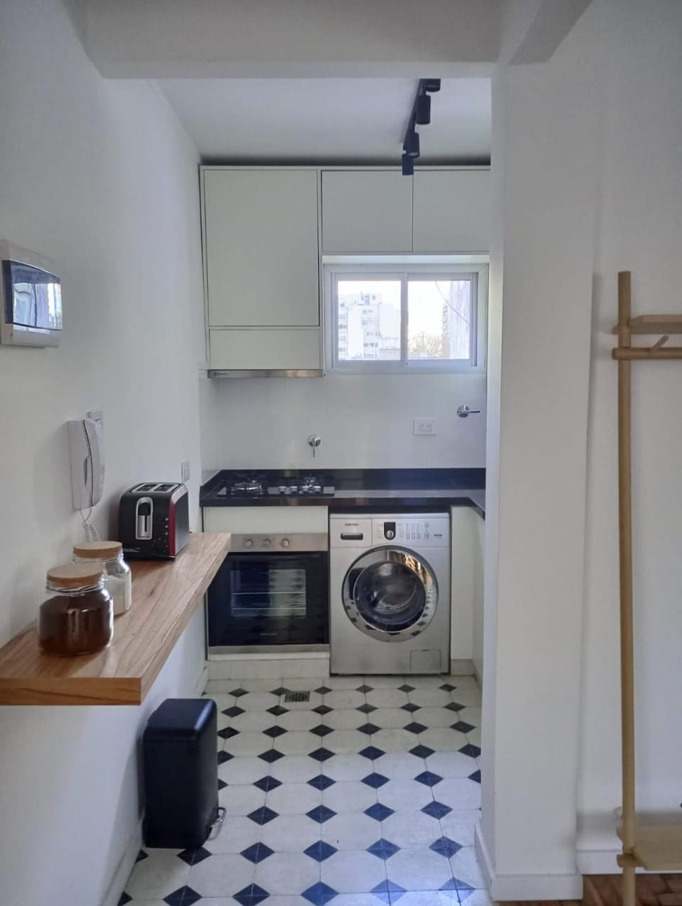 Kitchen or kitchenette, toaster, washing machine