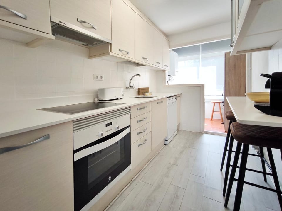 Kitchen or kitchenette, dishwasher, oven, stove, toaster