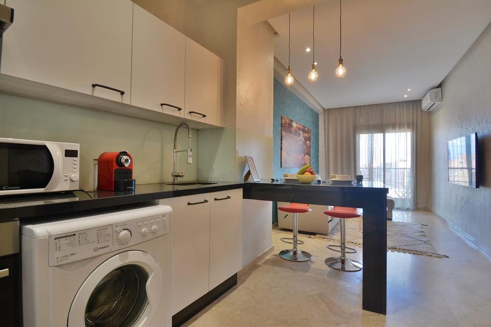 Kitchen or kitchenette, oven, stove, toaster, washing machine