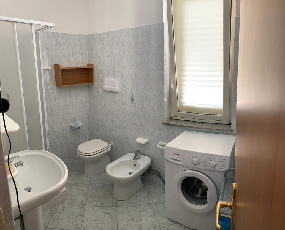 Toilet, Bathroom, bidet, towels, washing machine