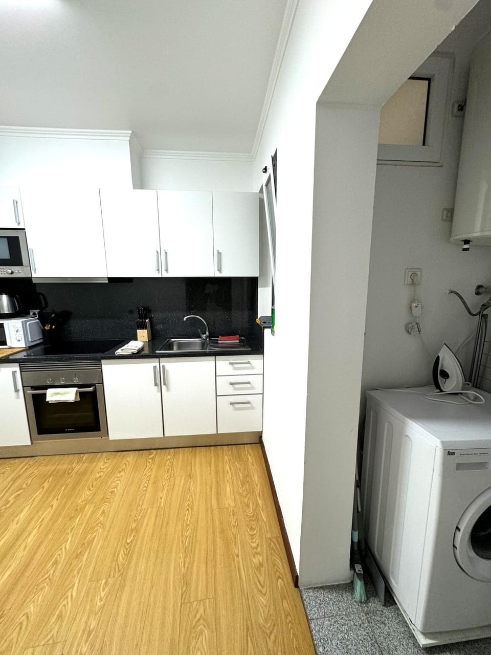 Kitchen or kitchenette, oven, stove, washing machine