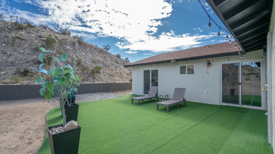 Property building, Patio, Natural landscape, Mountain view, sunbed
