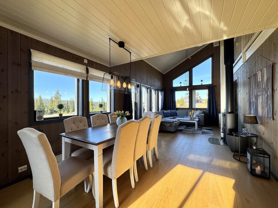 View (from property/room), Living room, Seating area, Dining area, fireplace