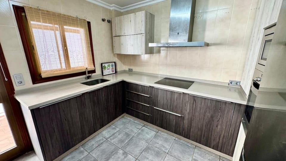 Kitchen or kitchenette, microwave, oven, stove